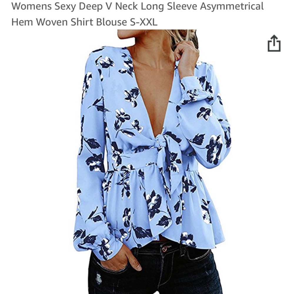Deep V long sleeve asymmetrical shirt.